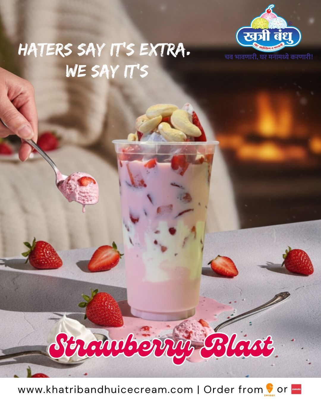 A tall glass of layered Strawberry Blast with creamy texture, strawberry pieces, and ice cream scoop on top.